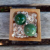 Green Aventurine helps to manifest abundance and luck in all areas of life - financial, love, work, etc... It removes negative energy so that you can overcome any obstacles blocking you from reaching your full potential. Promotes vitality & it’s strong connection to Earth which also makes it a perfect companion to any plant in need of growth. Green Aventurine is connected to the Heart Chakra. The sphere is said to be the universal body and the point of creation, it’s the only crystal shape that sends energy evenly in all directions Hold one in each hand during meditation, while doing mudras, or place one on your Heart to balance that Chakra. This includes TWO Green Aventurine Spheres selected from what’s shown in the pictures, approximately 0.90-0.95". It includes a bamboo tray on a bed of Clear Quartz crystals to amplify the energies. You’ll also receive a drawstring pouch & gift box. Color variances, nicks, imperfections and cracks are the nature of genuine gemstones & crystals.