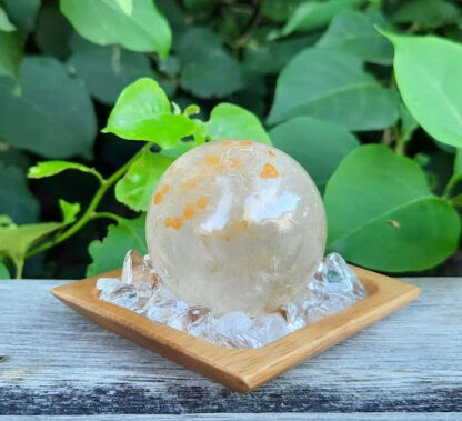 This set includes the Golden Healer Quartz Sphere shown, about 1.55,” on a bed of Clear Quartz crystals to amplify the energy. You'll also receive a bamboo tray, drawstring pouch & gift box. Color variances, nicks, imperfections and cracks are the nature of genuine gemstones, crystals and minerals. Keep on your bedside table to connect w/ your subconscious while dreaming or in any room to boost manifesting. Hold in a palm during meditation or place on any Chakra to activate / balance it. Golden Healer Quartz is a high vibration crystal that can scan your entire body both physically & energetically to help you find blockages to help you clear them. It’s not an overnight process but you will notice the rewards you’ll reap. It stimulates your creativity and opens you up to new possibilities of success bringing you abundance and prosperity. Aligns & connects all of your Chakras from your earthly body to Higher Realms. May this bring you creativity, success, abundance & prosperity.