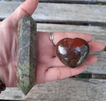 This includes the Wand about 4.2 x .7” & heart shown, about 1.7 x 1.5 x 1" . Color variances, nicks, imperfections and cracks are the nature of genuine gemstones, crystals and minerals. Dragonstone / Dragon Blood Stone / Dragon’s Blood Jasper is a combination of Epidote & Red Piemontite which is a form of Epidote. Epidote is an attraction stone increasing whatever it touches and magnifies what you create. Dragonstone is a stone of courage, strength, creativity & personal power. It aids in problem solving, helps you to better learn from past mistakes & helps you to remember the beauty of life to get you through feelings of self pity. It promotes happiness, optimism & inner knowing. Dragonstone activates the Root & Heart Chakras. The double terminated points allow you to send & receive energy. Hold in your left or non-dominant hand to receive energies or your right or dominant hand to send energies. The heart shape represents divine love, emanating kindness, care & understanding.